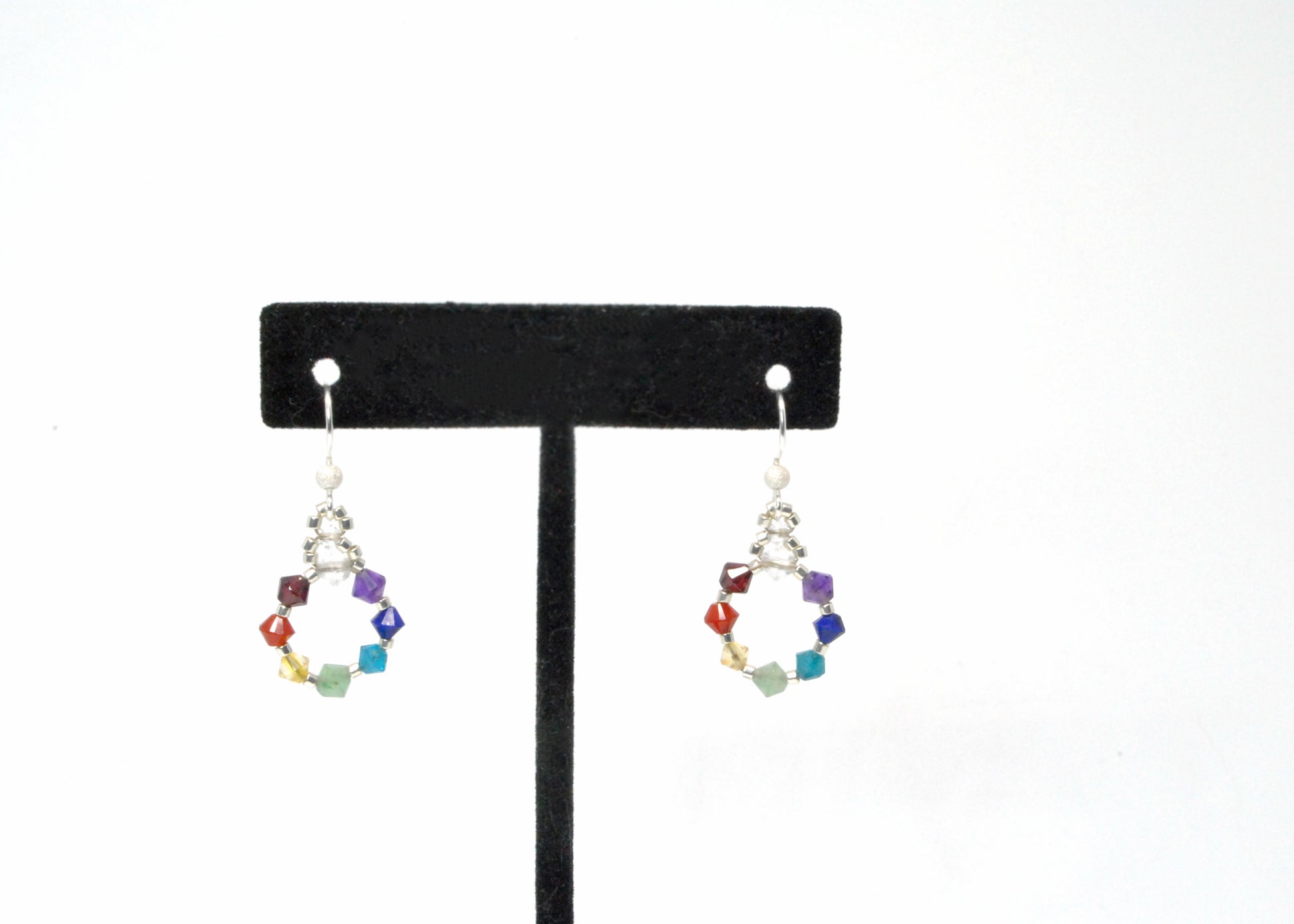 rainbow gemstone chakra earrings woven in a circle pattern. nickle free and lightweight due to the woven style. 