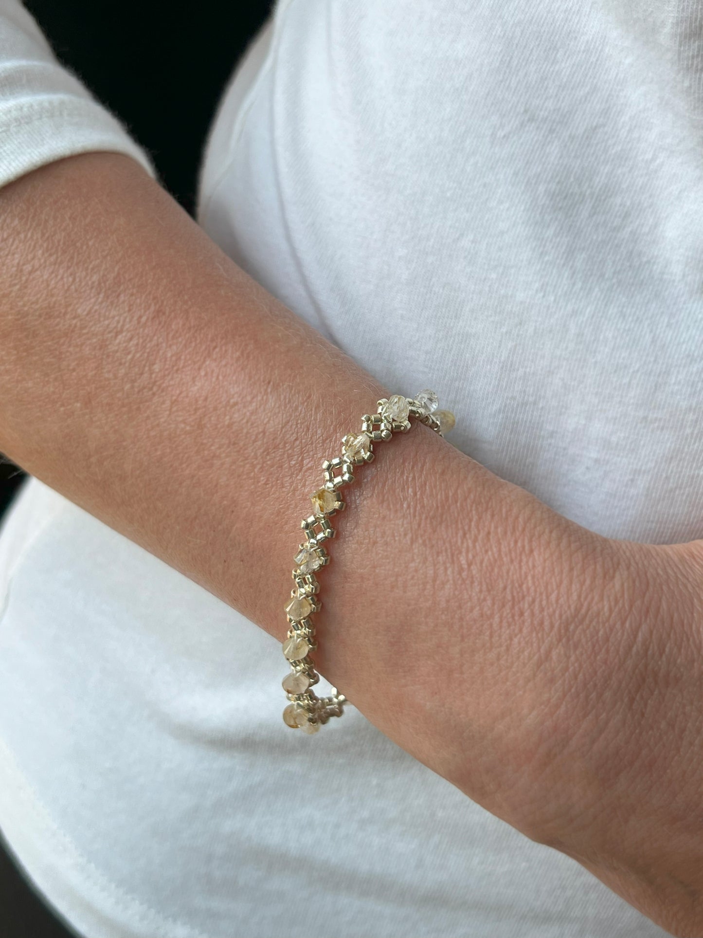 gold rutilated quartz gemstone . diamond pattern bracelet