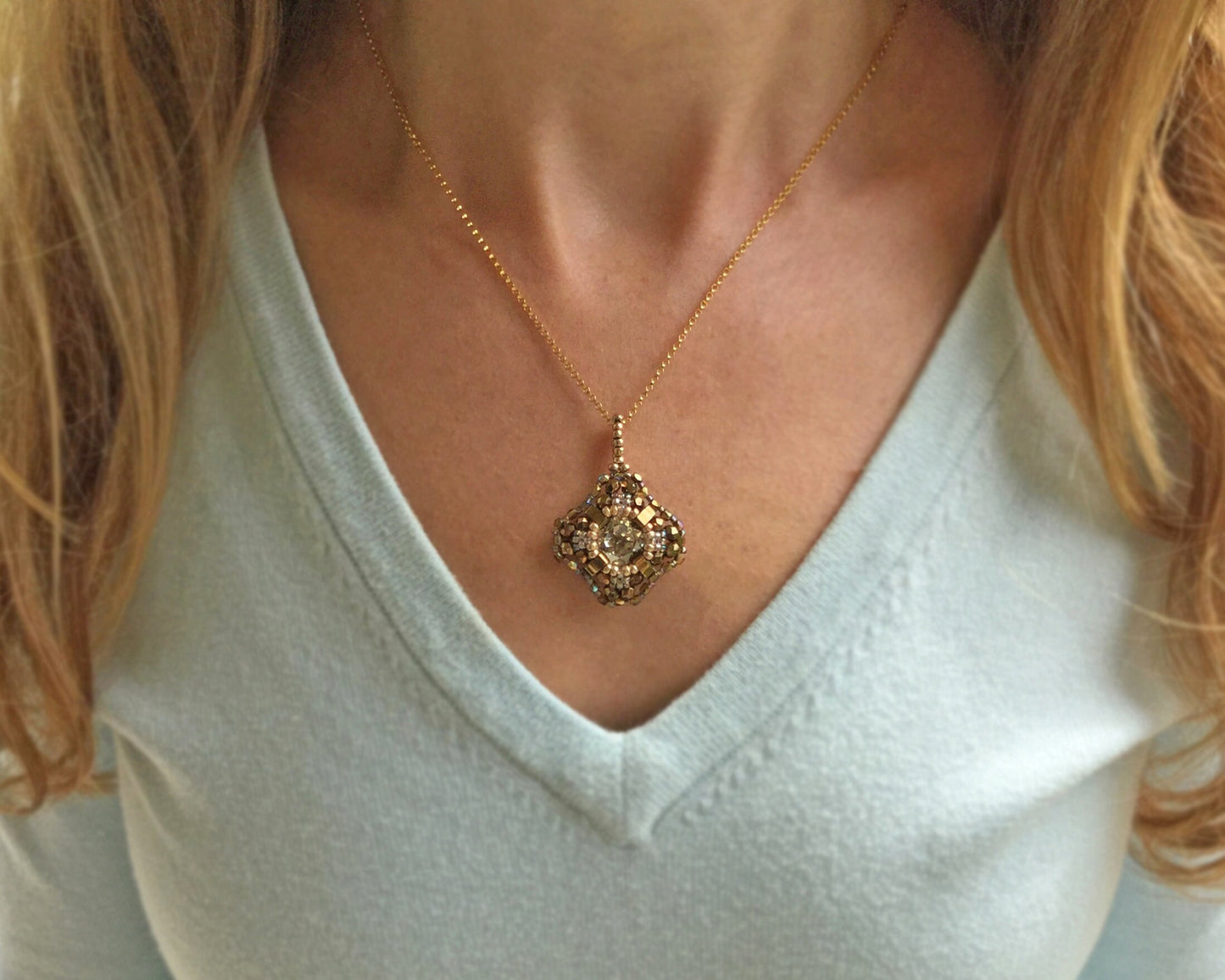 gold and iridescent swarovski crystal cushion cut pendant necklace . #014