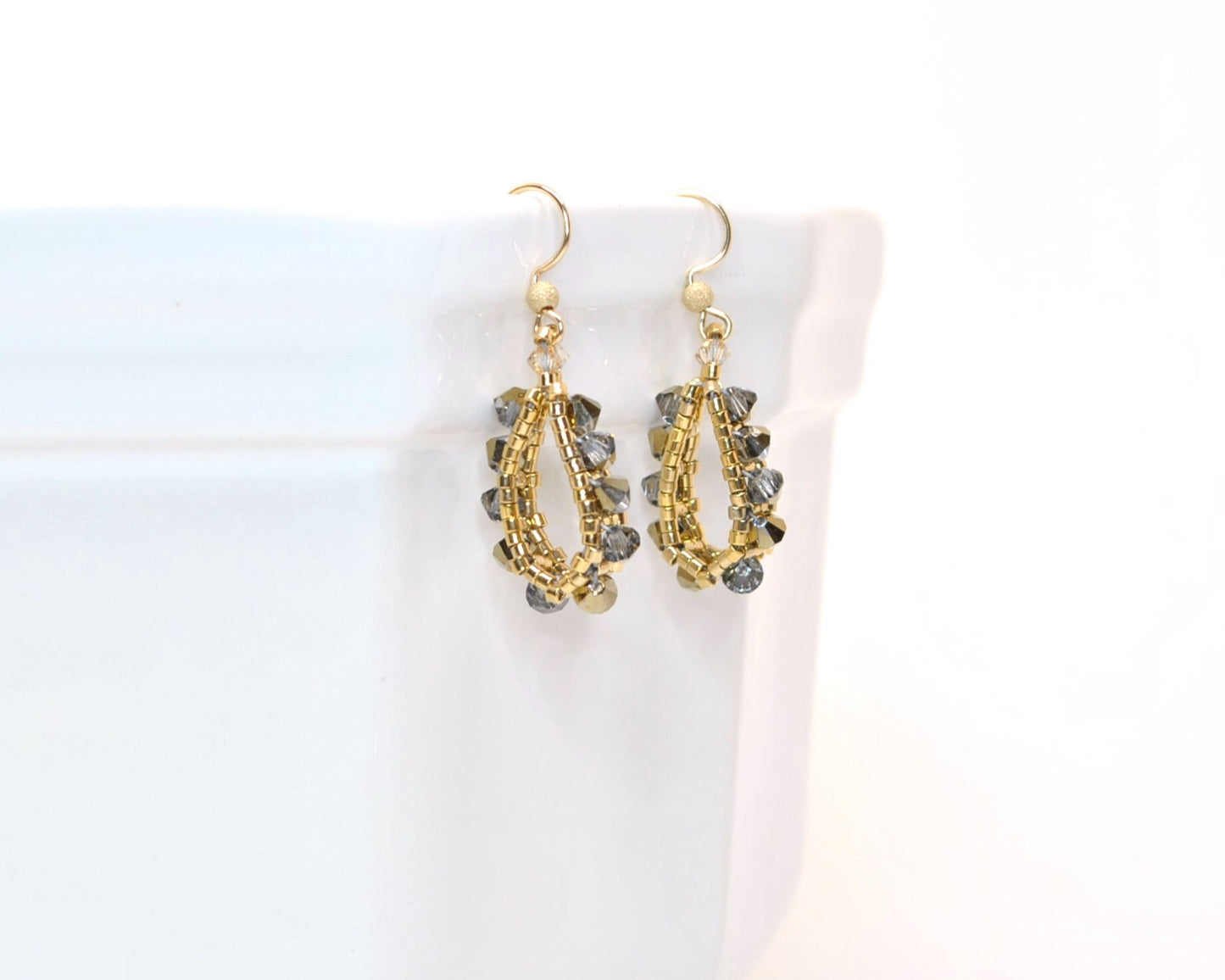 gold and swarovski crystal earrings . small hoop earrings . loop teardrop shaped crystal earrings . modern gold crystal earrings . urban .