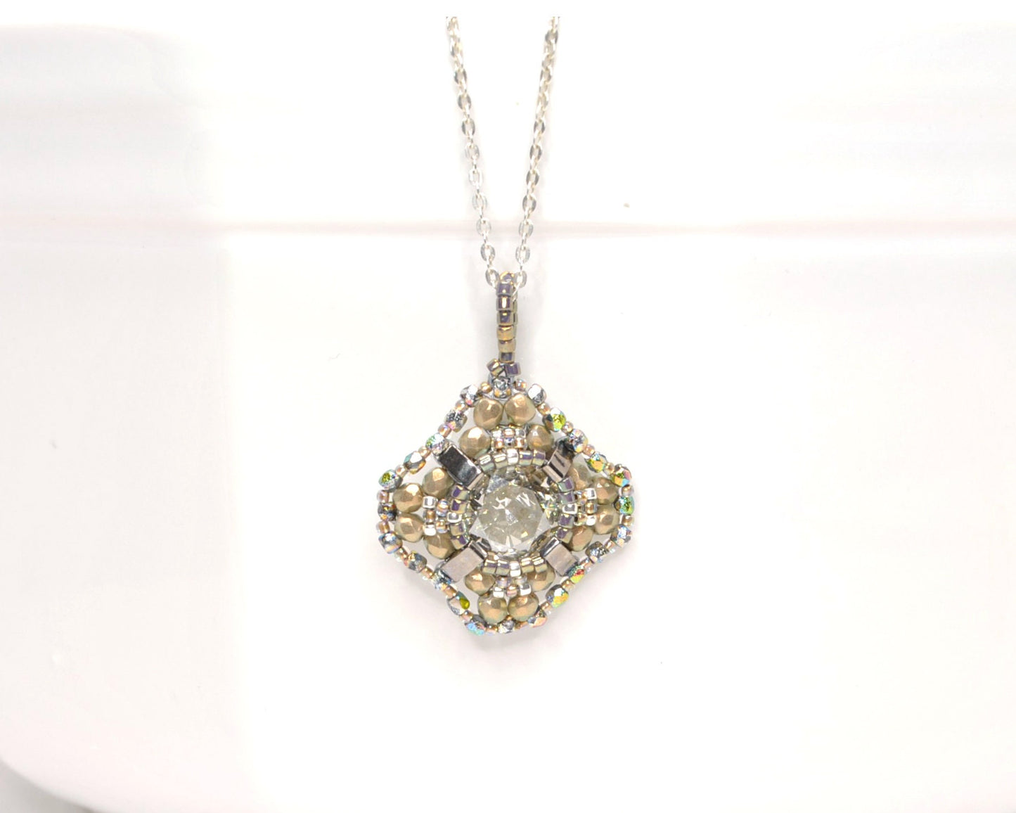 gold beaded swarovski crystal cushion cut pendant . #033