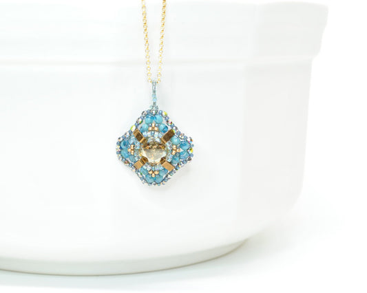 ocean blue and gold bronze crystal pendant necklace . #024